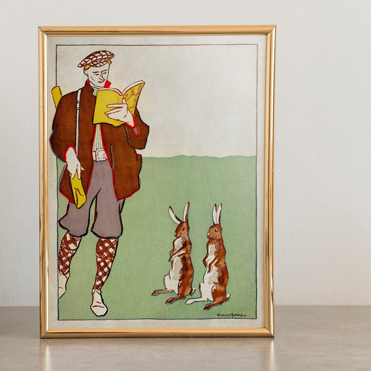 Man Reading A Book With Hares by Edward Penfield